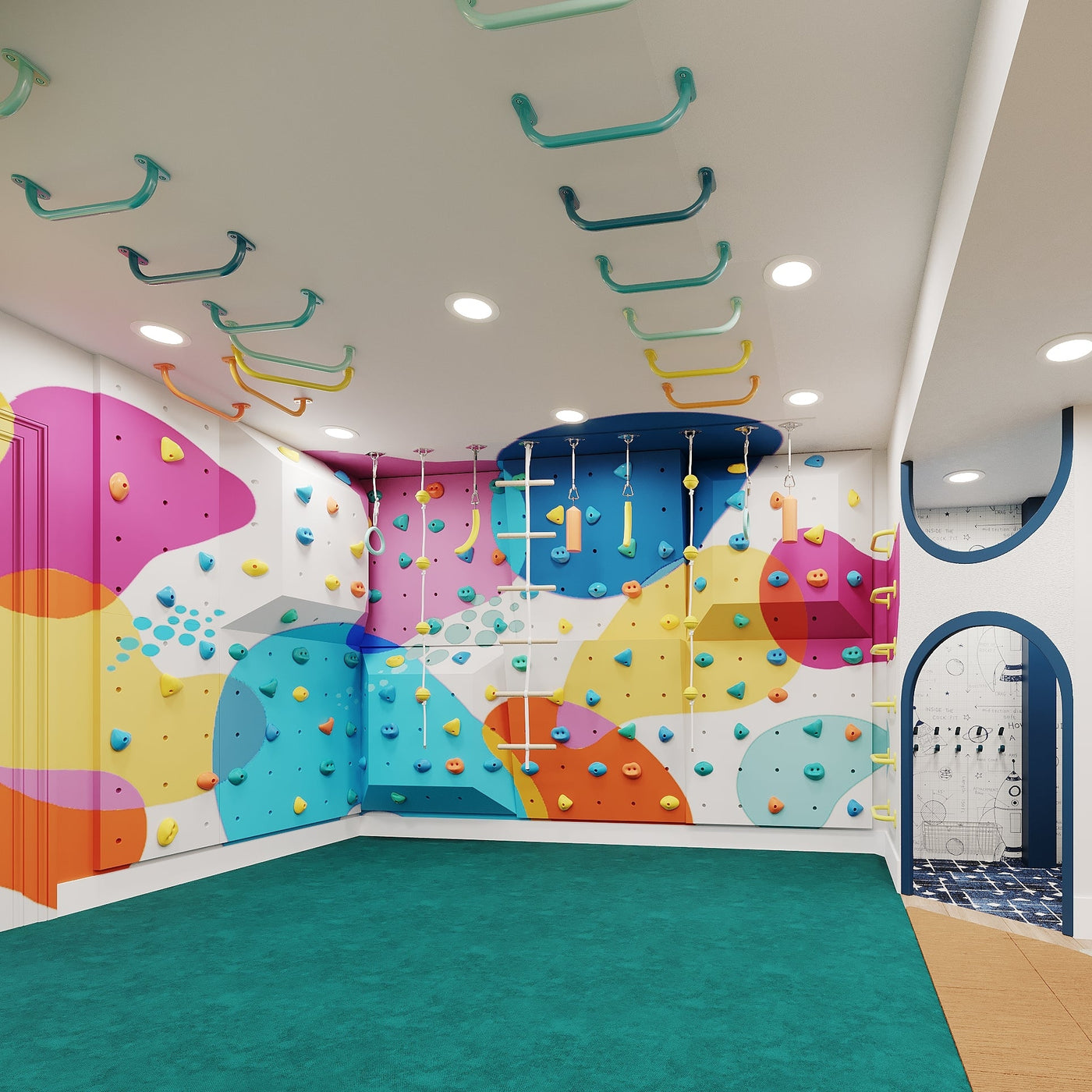 Colorful indoor playground with climbing wall and colorful floor.