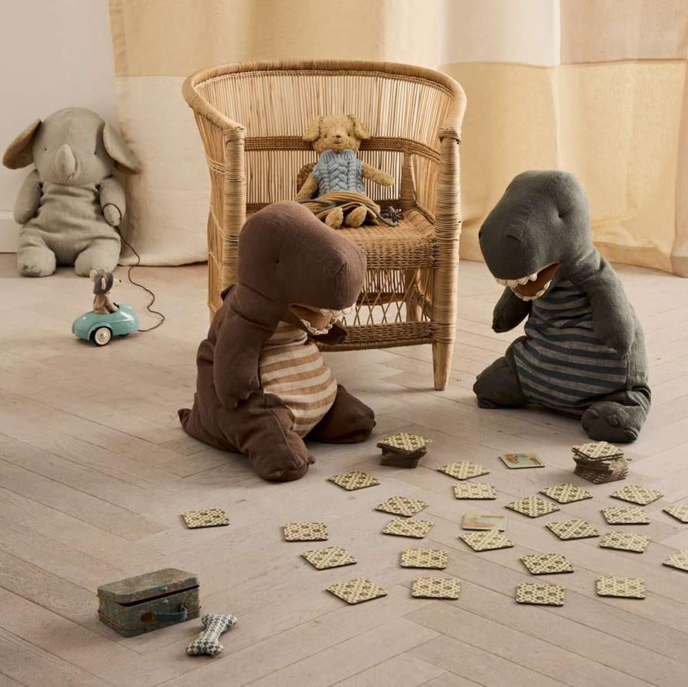 Children's room with stuffed animals playing on the floor