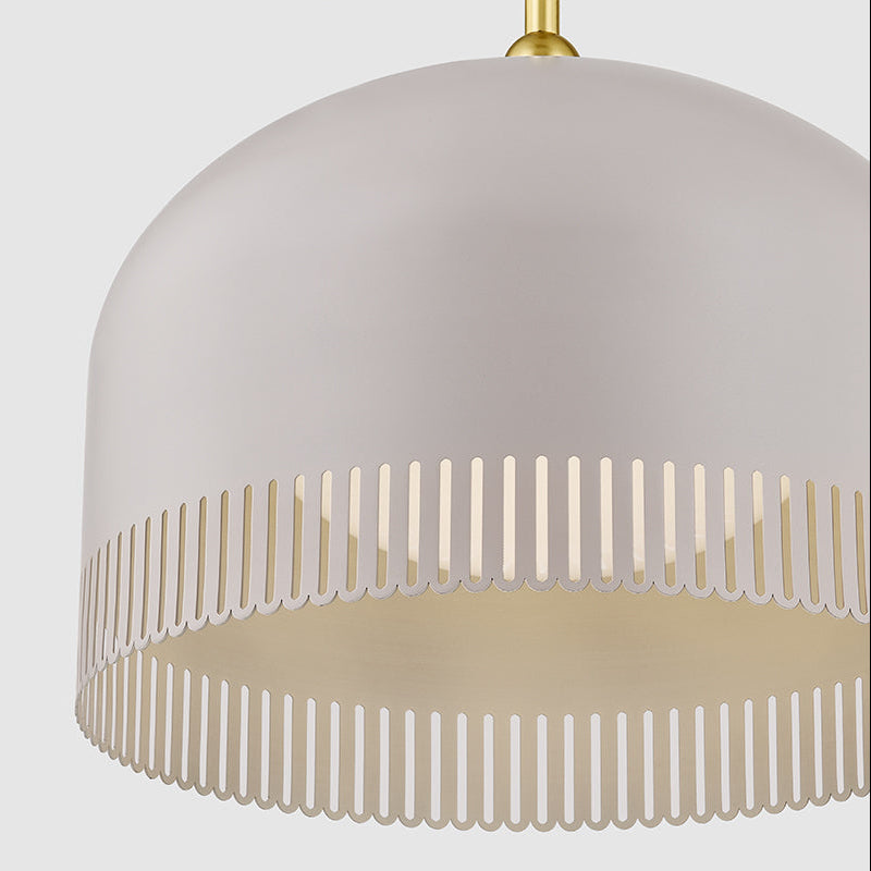 Modern pendant light with a white shade and gold accents on a light gray background