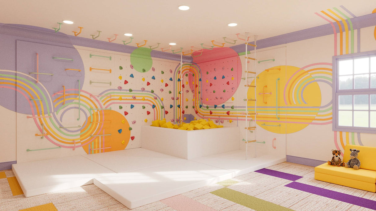 Large Pastel Rainbow climbing wall bundle with Back on Track mural, bright holds, and padded safety mats.
