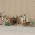 Miniature diorama with toy mice and furniture against a patterned wall.