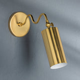 Gold wall-mounted lamp on a gray background