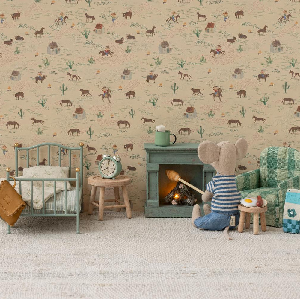 Children's room with toy furniture, teddy bear, and decorative wallpaper featuring animals and nature.