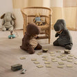 Children's room with stuffed animals playing on the floor