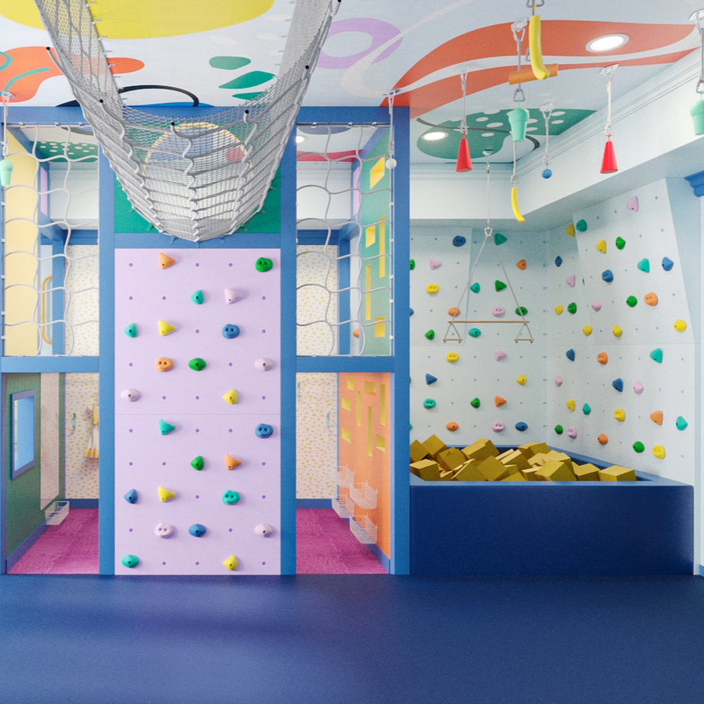 Colorful indoor playroom with climbing wall and slide