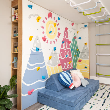 Children's room with colorful wall mural, blue sofa, and decorative elements.