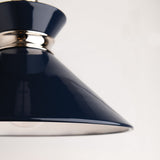 Close-up of a dark blue lampshade with a light gray background