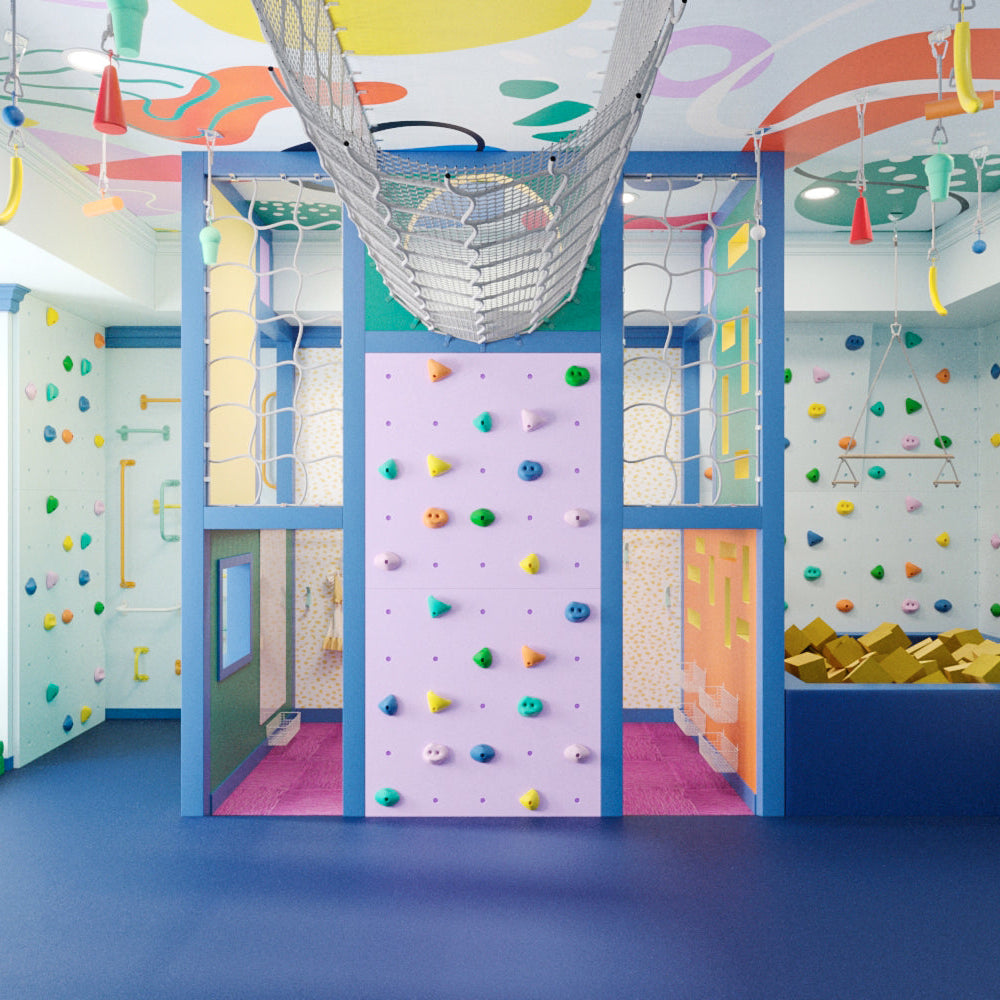 Colorful indoor playroom with climbing wall and slide