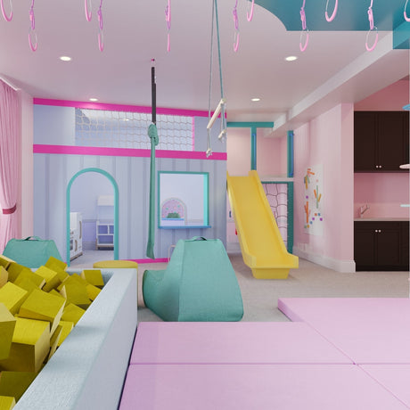 Colorful indoor playroom with slides and soft play equipment.