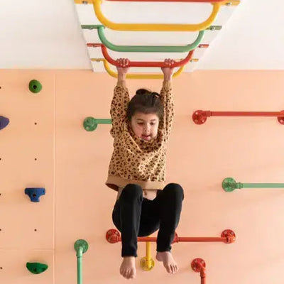 Child climbing on a colorful攀爬架